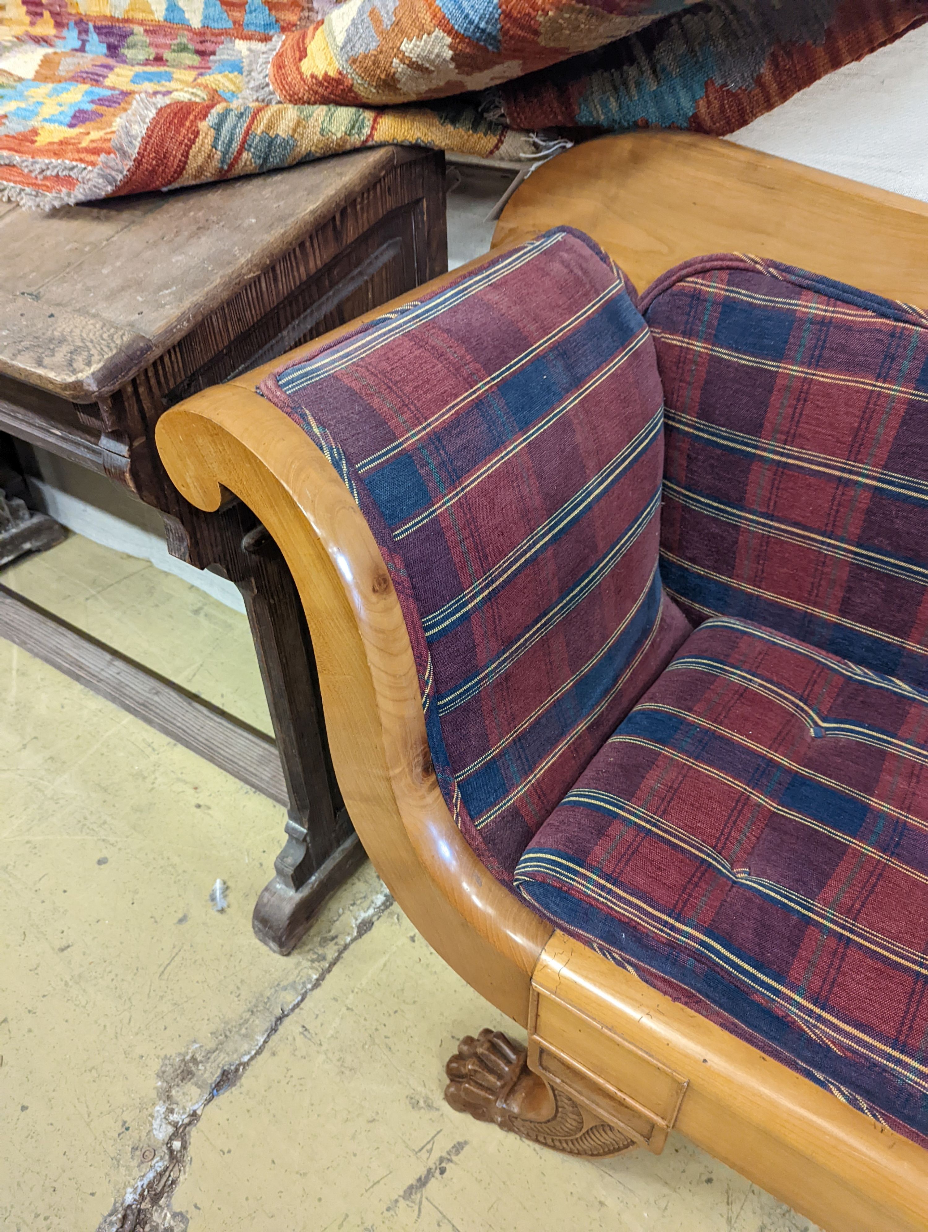 A Biedermier style cherry scroll arm settee with buttoned squab cushion on carved claw feet, length 200cm, depth 51cm, height 97cm